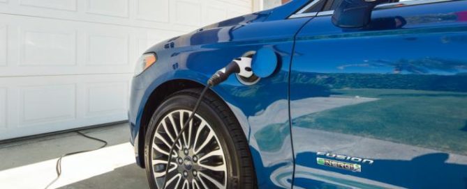 Electric Vehicle Owners are Discovering Even More Savings. EV is being charged at home.